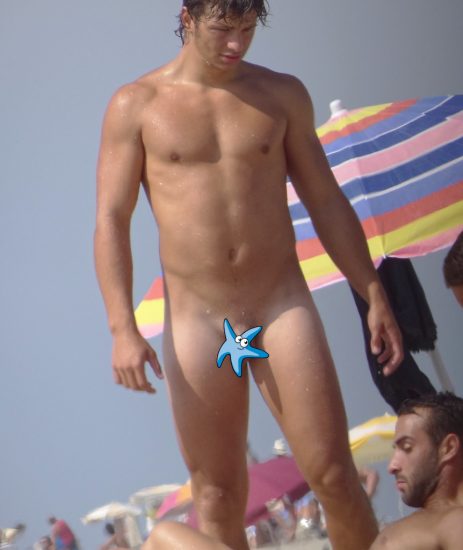Beefy nude guy at the beach