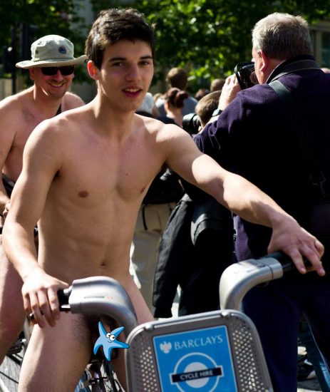 Cute nude boy on a bike