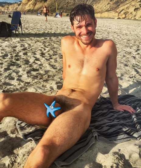 Happy man on the nude beach