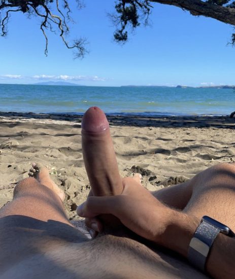 Man jerking off on the beach