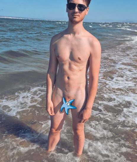 Naked guy by the sea