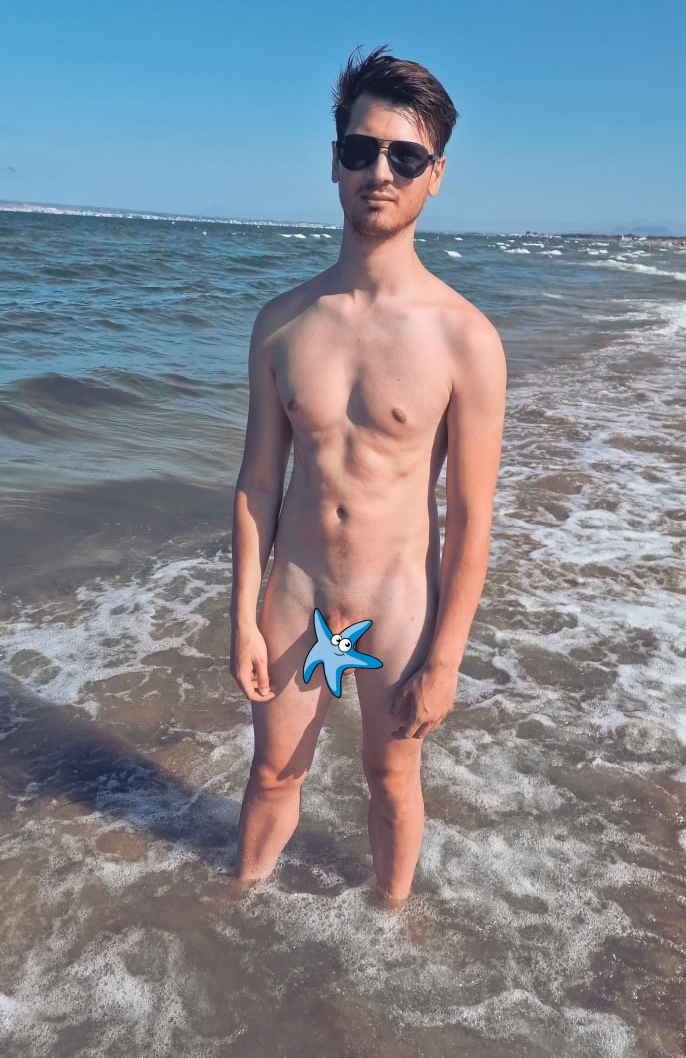 Naked guy by the sea
