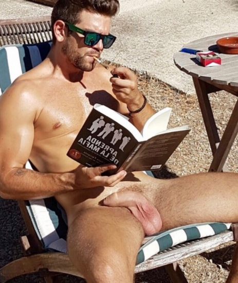 Naked man reading a book