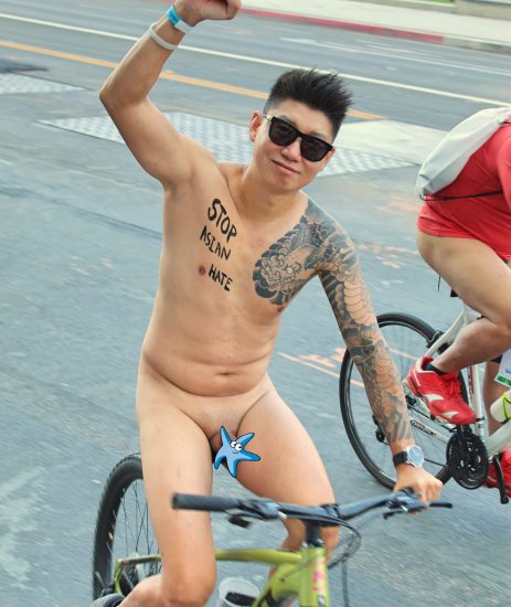 Nude Asian boy on a bike