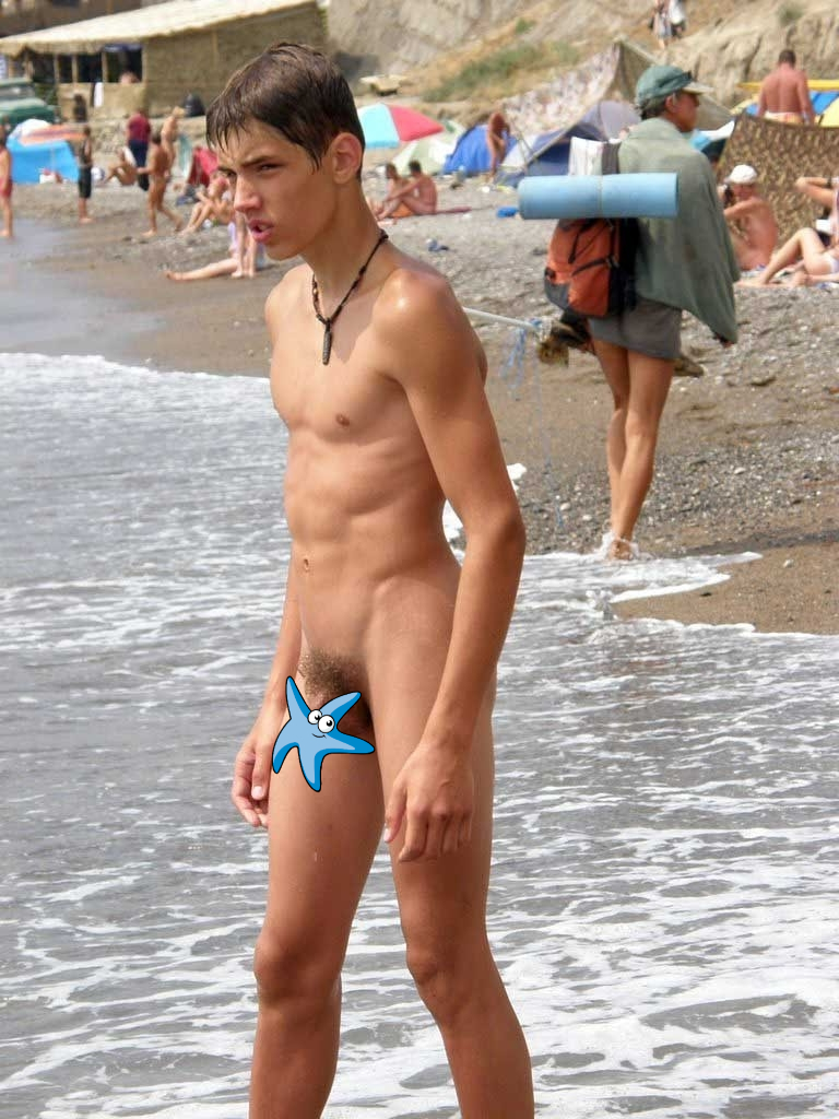 Nude boy at the beach