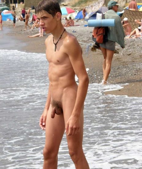 Nude boy at the beach