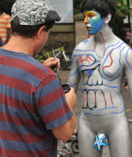Nude boy fully body painted