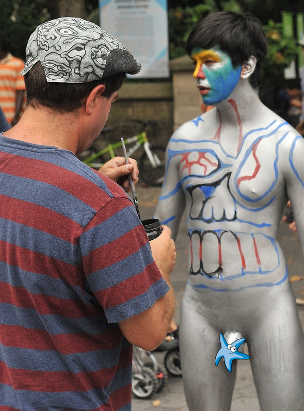 Nude boy fully body painted