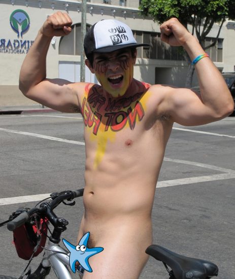 Nude boy on a bike