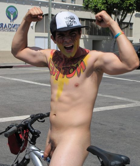 Nude boy on a bike