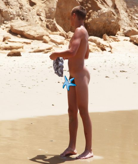 Nude boy on the beach