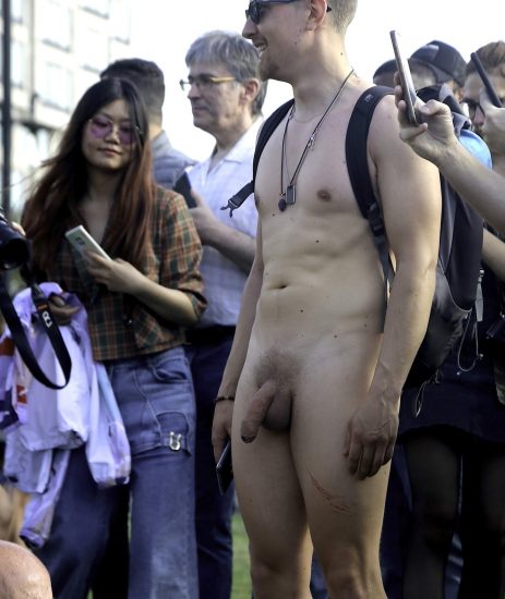 Nude man with clothed people