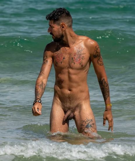 Tattooed nude beach man