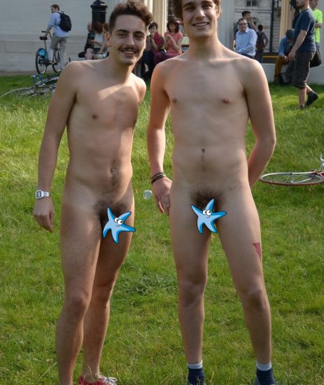 Two nude guys in a park