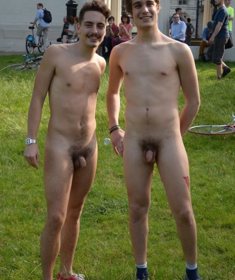 Two nude guys in a park