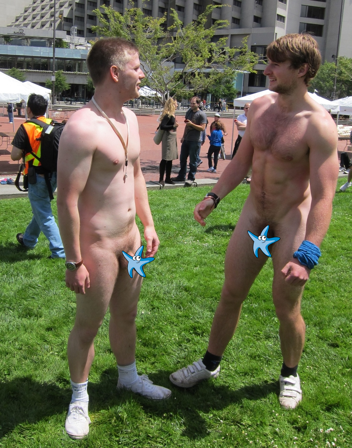 Two nude guys on a lawn