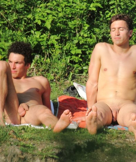 Two nude guys outdoors